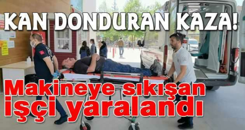 Makineye sıkışan işçi yaralandı