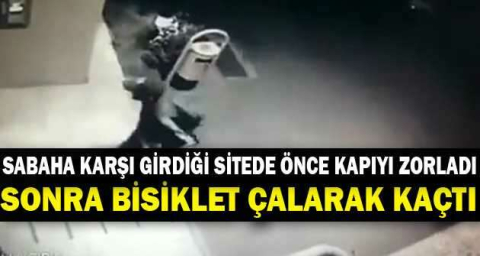 Sabaha karşı girdiği sitede önce kapıyı zorladı, sonra bisiklet çalarak kaçtı