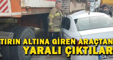 Tırın altına giren araçtan yaralı çıktılar
