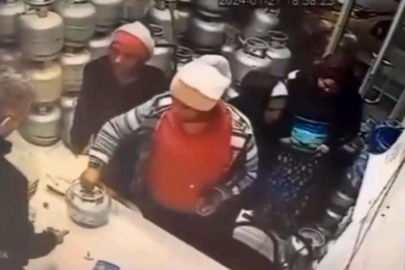 Piknik tüpünü saniyeler içerisinde eteğinin altına sokup böyle çaldı