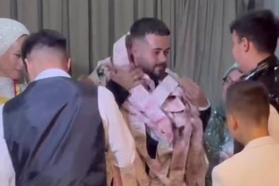 Bursa’da damadı paraya boğdular