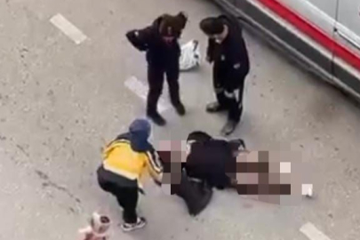 Yolun ortasında yatan kadın, sinir krizi geçirdi