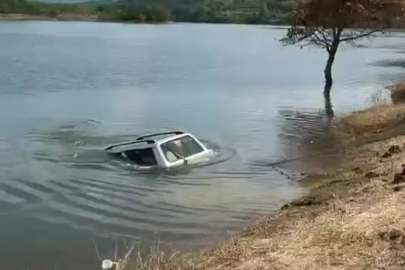 Baraja düşen otomobili 5 metre dalarak çıkardı