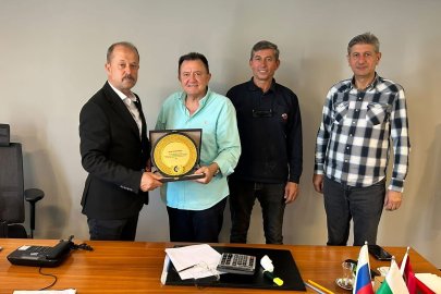 Yenişehir TSO'dan 30 yıllık üyesi Saim Bolaca'ya anlamlı plaket