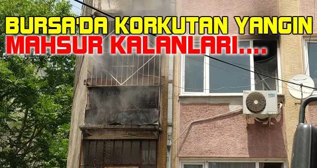Bursa'da korkutan yangında mahsur kalanları kapıyı kırarak kurtardılar